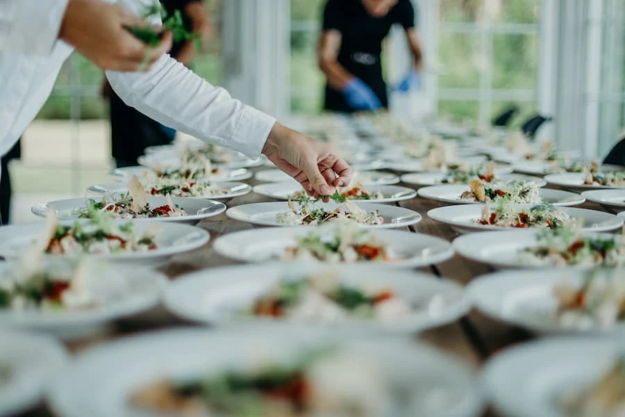 Chef finishing plates for a private event