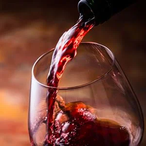Red wine being poured into a glass