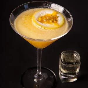 Martini garnished with passion fruit