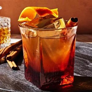 Old-fashioned style cocktail with citrus peel